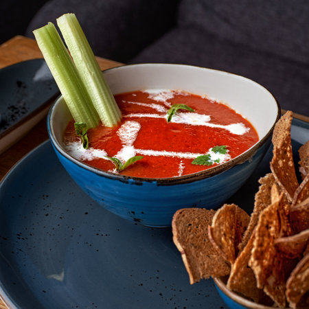 Fresh, healthy tomato soup with basil, pepper, garlic, tomatoes and bread. Spanish gazpacho soup....
