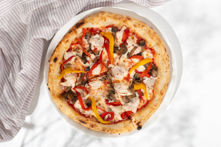 Pizza with chicken and mushrooms on white background for restaurant menu. top viewの写真素材