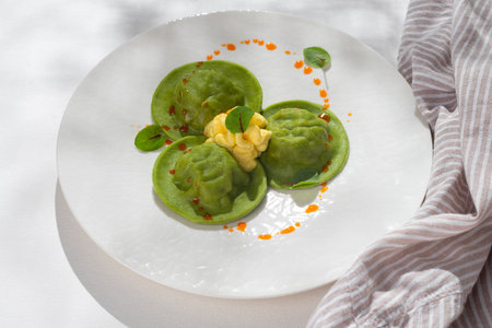 Delicious Dumplings and dill - russian pelmeni - italian ravioli - on white background for restaurant menu.の写真素材