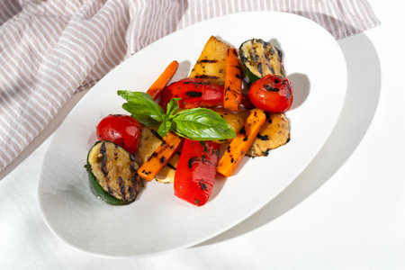 Vegetable salad with grilled red capsicum, sweet potato, zucchini and parsley. selective focus. Healthy concept, menu.の写真素材