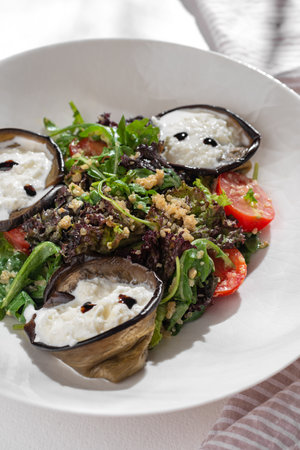 Vegetarian Salad with eggplant and strachatella, Cherry Tomatoes and quinoa on white background for restaurant menu.の写真素材