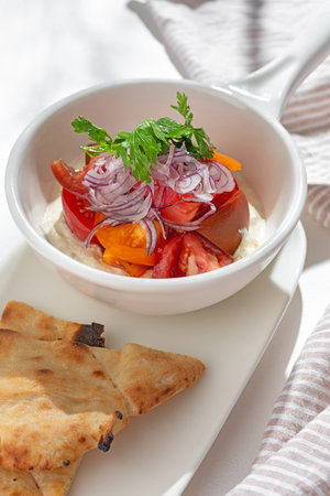 appetizer. Vegetable salad: greek yogurt with cream cheese, tomatoes on white background for restaurant menu.の写真素材