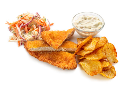 Chicken schnitzel tempura, cabbage coleslaw and potato chips on a light background, top view. Delicious lunchの写真素材