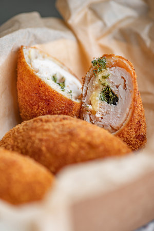 Close up Chicken Kiev Cutlets. Breaded Chicken Kiev breast stuffed with butter, garlic and herb. Chicken patties cakes fried in breadcrumbs.の写真素材
