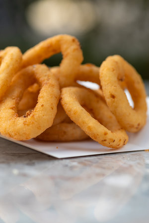 Fast Food Restaurant, food delivery, takeaway food, paper containers with Onion Rings and sauce. menu, close-upの写真素材