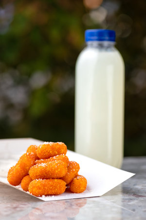 food delivery, cheese sticks takeaway food, paper containers with Breaded mozzarella cheese sticks and sauce. menu, close-upの写真素材