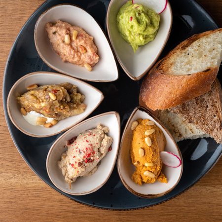 Set Healthy snack or snack with Hummus, rabbit pate, eggplant caviar, guacamole, tuna pate in bowls....