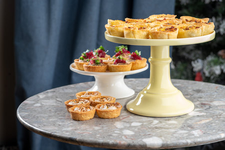Tartlets stuffed with codfish liver, codfish caviar and microgreens. Traditional cold portioned...
