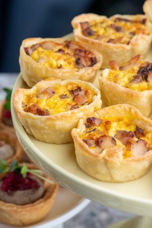 Tartlet stuffed. Baked with cheese. Traditional cold portioned appetizer in a pastry basket....