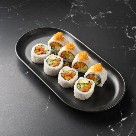 Vegan Futomaki with zucchini, celery stalks, carrot, red cabbage, red bell pepper.の写真素材