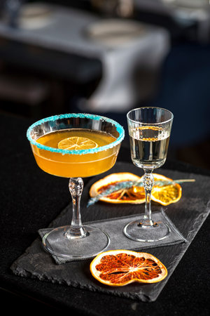 Pornstar martini cocktail with passion fruit and vodka, served with sparkling wine in a separate glass.の写真素材