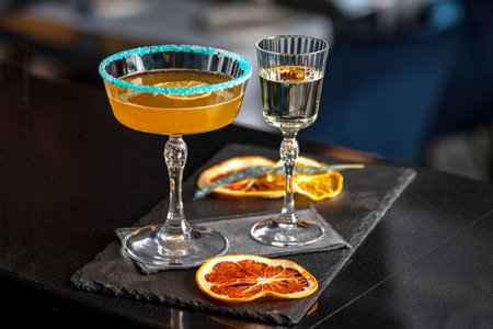 Pornstar martini cocktail with passion fruit and vodka, served with sparkling wine in a separate...