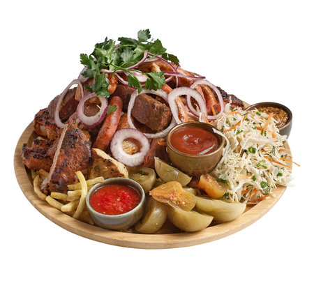 Meat plate with delicious pieces of meat, salad, ribs, grilled vegetables, potatoes and sauce, isolated on white. photo for the menuの写真素材