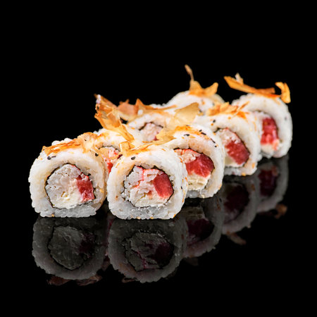 Sushi roll with tuna, shrimp, salmon, smoked eel, avocado, philadelphia cheese on black background. Sushi menu. Japanese food.の写真素材