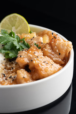 stir-fried shrimps with garlic and shrimps paste with rice on a black background with reflection. menu restaurant.の写真素材