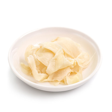 Grated ginger in Glass Bowl on white background.の写真素材