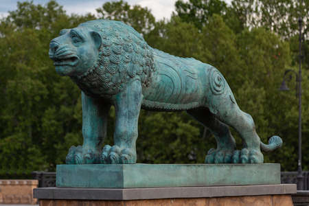 Lion on the G. Tabidze bridge in the city of Tbilisi. Georgia. Statue of bronze green from timeの写真素材