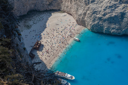 Navagio beach on the Greek island of Zakynthos, crowded with peopleの写真素材