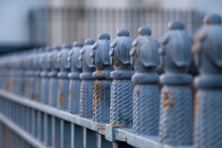 Antique wrought iron fence with shallow depth of field.