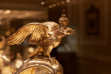 Statuette of a golden double-headed eagle with a crown.のeditorial素材