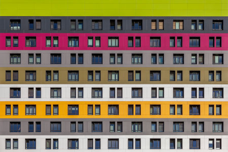 Geometric background from multi-colored rows of windows of a multi-storey building.のeditorial素材