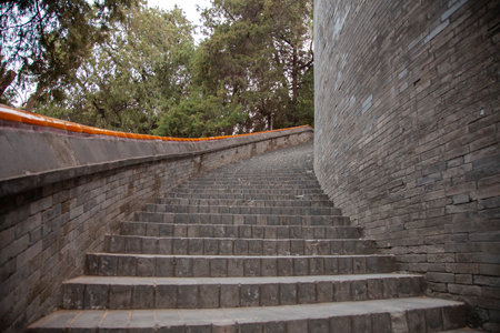 An ancient stone spiral staircase stretching into the distance
