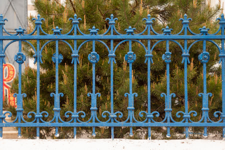 Antique wrought iron ornate fence in blue.の写真素材