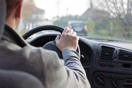 driver in the car country road hand wheelの写真素材