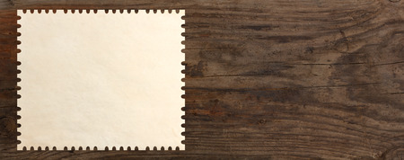 paper stamp post old wooden table backgroundの写真素材