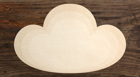 paper piece cloud shape wooden background templateの写真素材