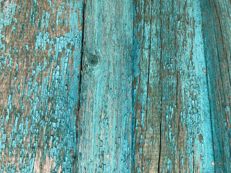 light blue wooden house wall with peeling old paint, texture. peeled blue paint on wood texture - vintage backgroundの写真素材