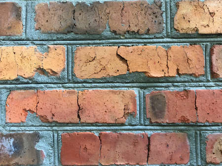 An old brick wall showing close up detail. Vintage brick wall close-up, background textureの写真素材