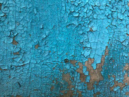 Vintage painted wooden background. A weathered close-up of cracked paint on a wood board looks like a creatively crafted textured background. Wood textureの写真素材