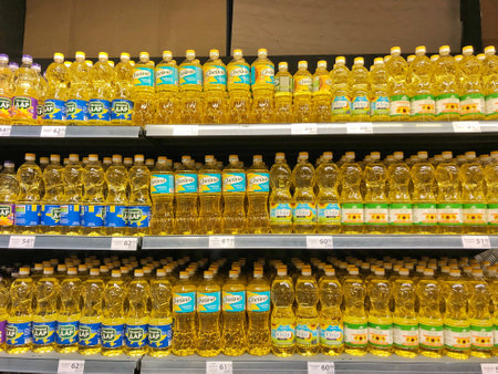13.08.2022, Ukraine, Kharkiv, a shelf in a supermarket .sunflower oil in a bottle on a store shelfの写真素材