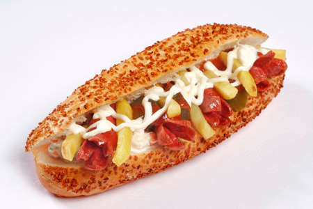 Hot dog with sausage on a white background. Close-up.