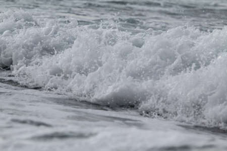 Waves on the seashore. Close-up. Selective focus.の写真素材