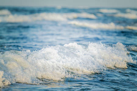 Waves in the sea on a sunny day. Selective focus.