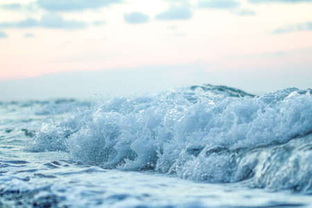Beautiful sea waves at sunset. Soft focus.の写真素材