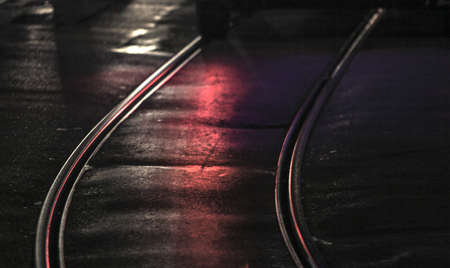 Tram tracks in the city at night, close up. 3d renderingの写真素材