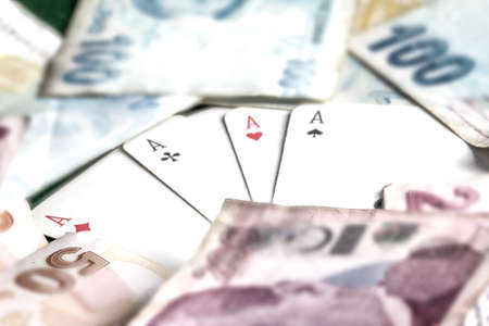 Playing cards and money, close-up, shallow DOF.の写真素材
