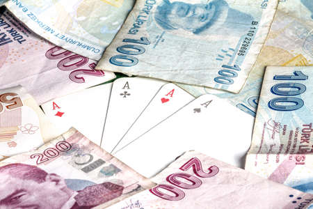 Playing cards and money of different countries. The concept of gambling.の写真素材
