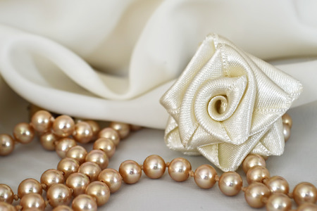 Handmade silk rose and pearlsの写真素材
