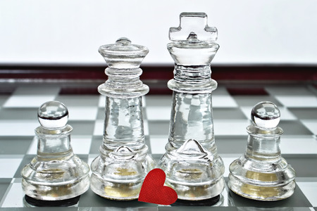King, queen and pawns on chess board Happy family conceptの写真素材