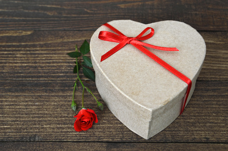 Heart shaped gift box on wooden backgroundの写真素材