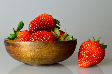 Strawberries in wooden bowlの写真素材
