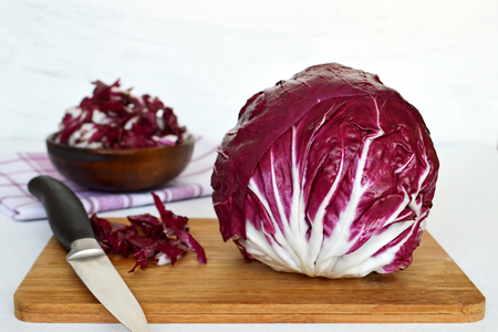 Red salad on wooden boardの写真素材