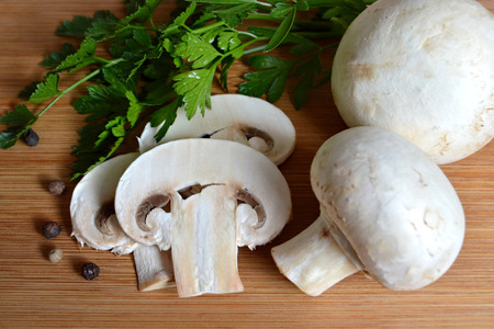 Mushrooms on wooden backgroundの写真素材