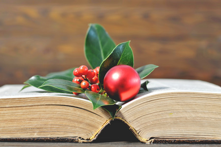 Christmas background with Christmas decoration and old book