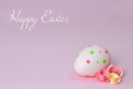 Happy Easter card with Easter egg on pink backgroundの写真素材