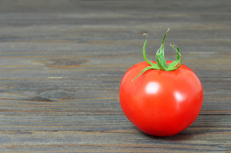 Tomato on wooden backgroundの写真素材
